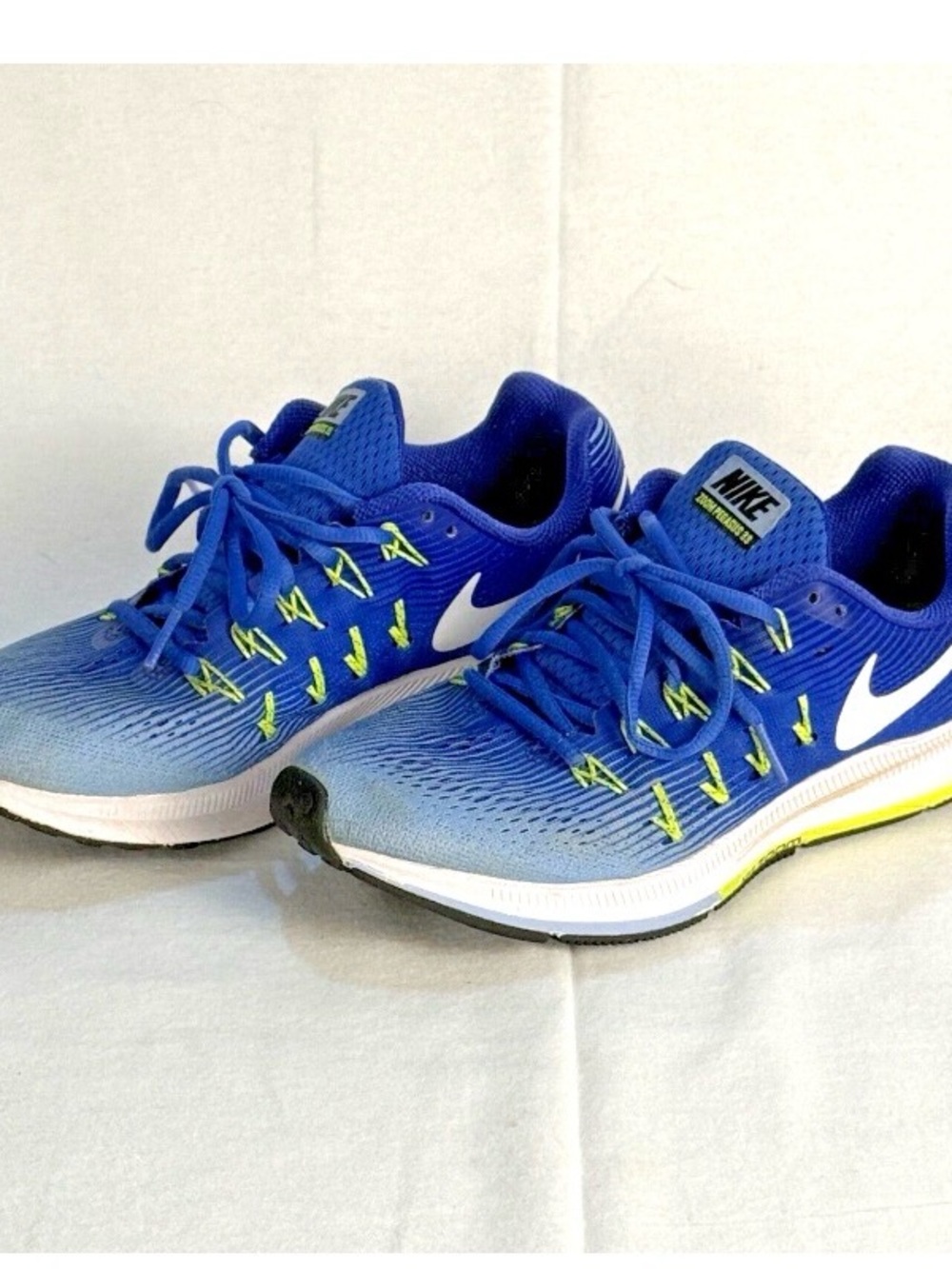 Nike Blue Athletic Shoes with Neon Green Accents and White Swoosh
